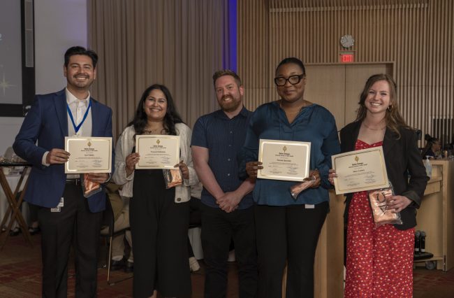 MPH 2024 graduates smiling in a group photo